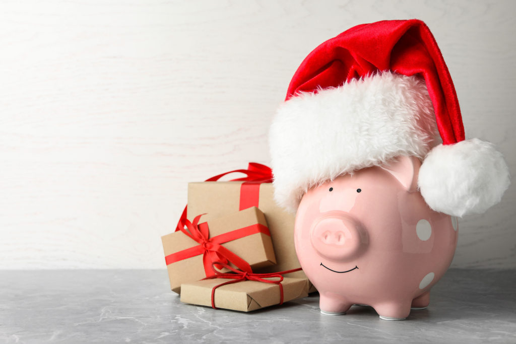 Gold Buyers Make Extra Christmas Cash Pig In Elf Hat With Presents
